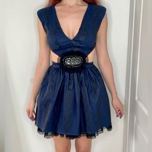 A mini ‘leather’ imitation dress. Snake print.